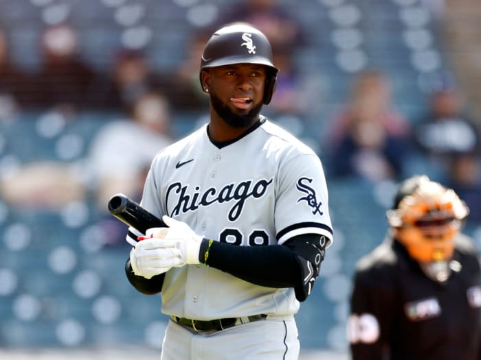 Chicago White Sox’s Luis Robert reacts after striking out against the Cleveland Guardians during the sixth inning in the first game of a baseball doubleheader, Wednesday, April 20, 2022, in Cleveland.